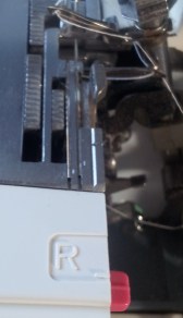 Stitching Finger withdrawn under plate