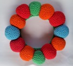Crochet Balls sewn in place on christmas wreath