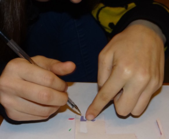 Family activity cutting out numbers