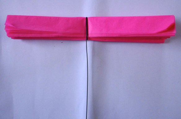 Gather folded tissue paper and wrap florist wire around centres