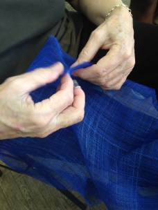 measuring and marking sinamay strip around block